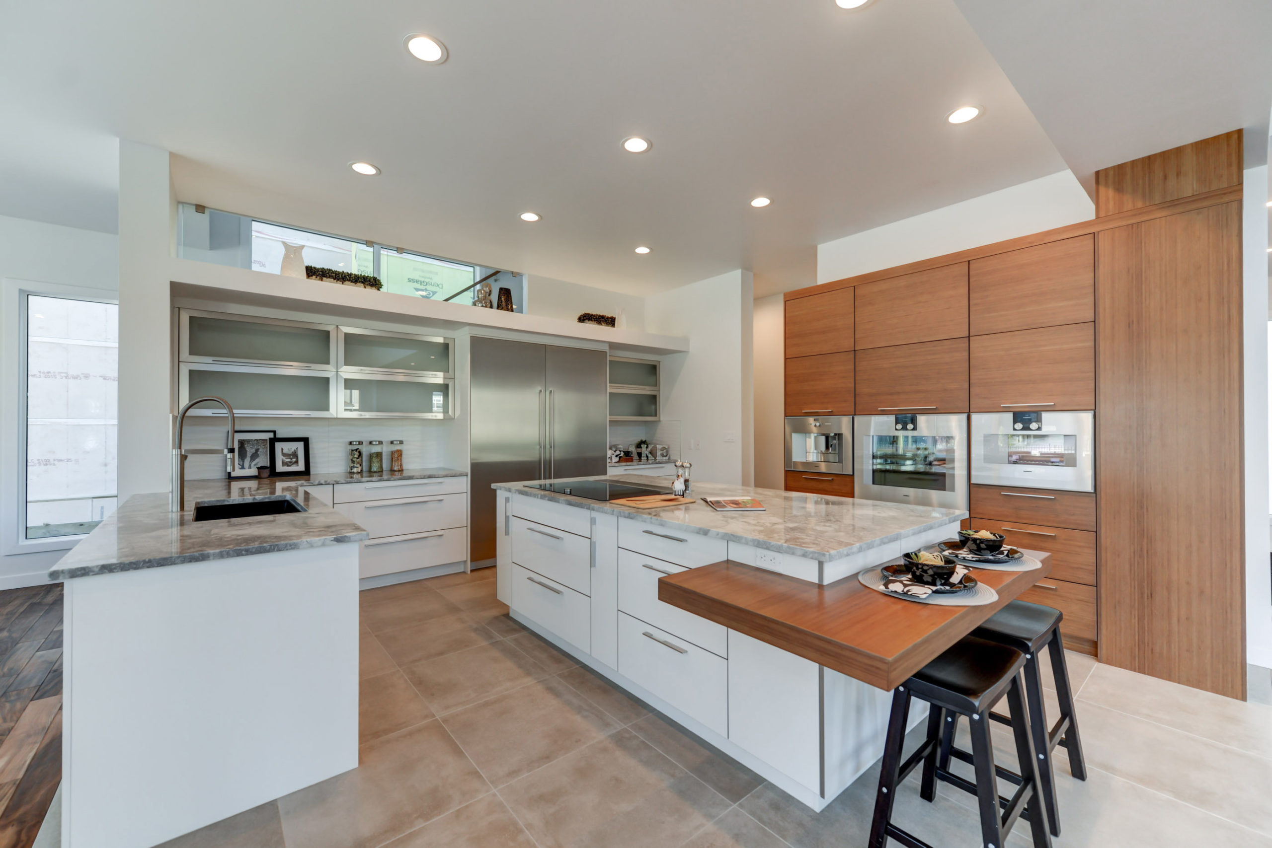 Unique Eat-In Kitchen Seating and Oven Wall Cabinets in Modern Kitchen Design