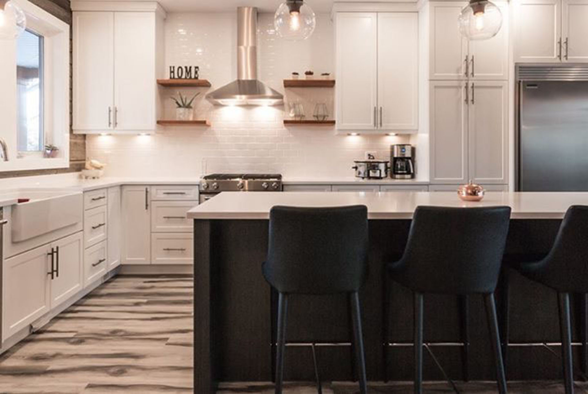 White Shaker Cabinets with Open Shelves and Dark Island