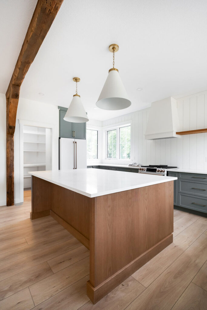 Two-tone kitchen cabinets Regina oak island sage green perimeter Salem shaker doors Kitchen Craft