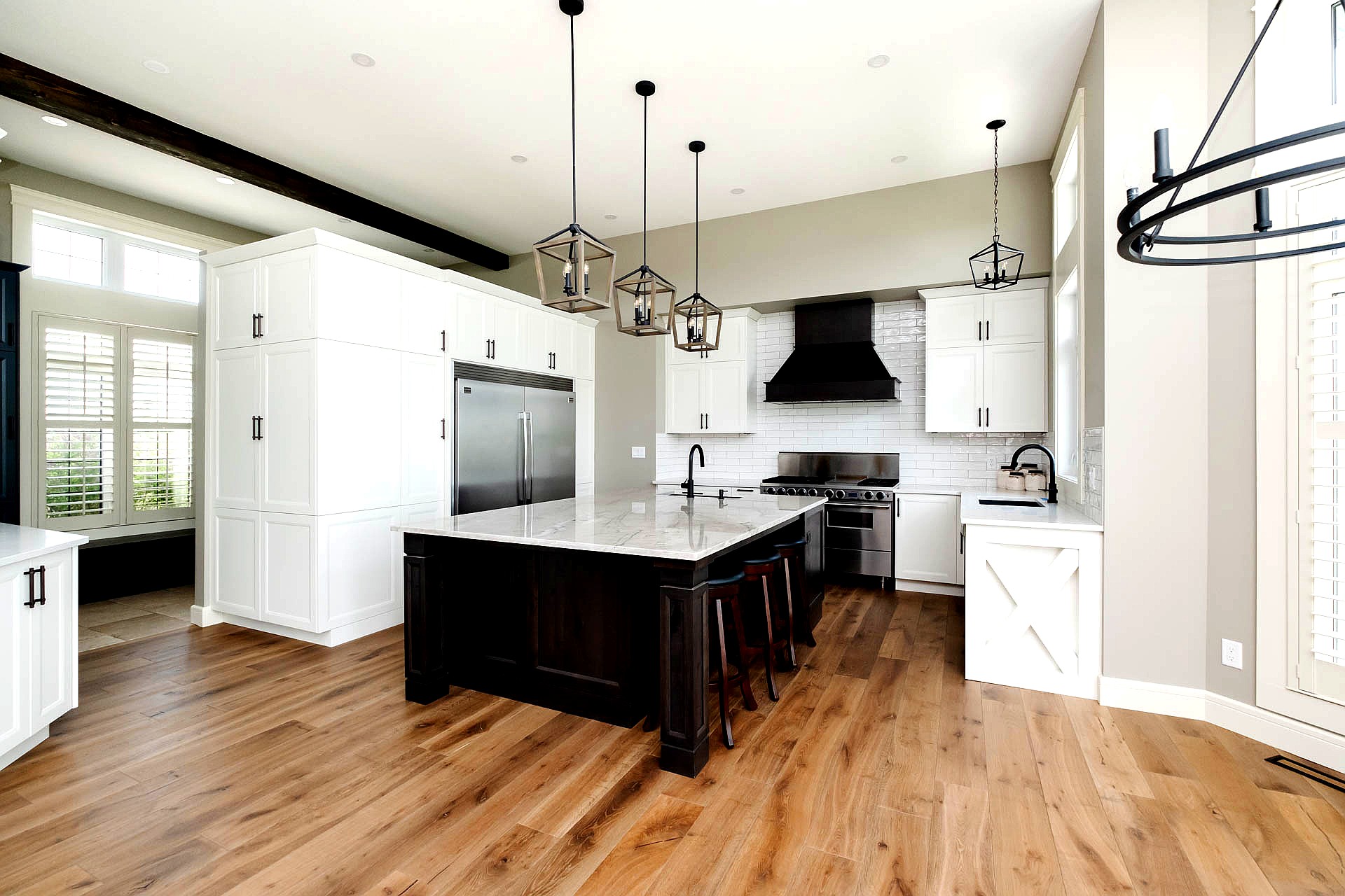Spacious Kitchen with Dark Stain Cabinet Island and Hood